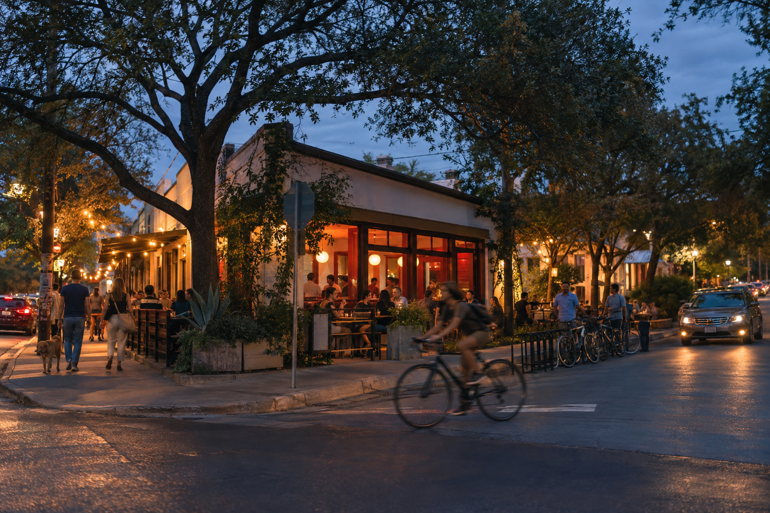 Austin neighborhood street at blue hour with warm restaurant light