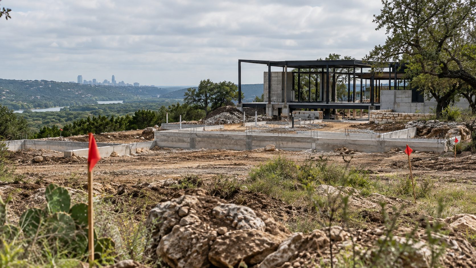 Early-stage development site surrounded by Central Texas landscape